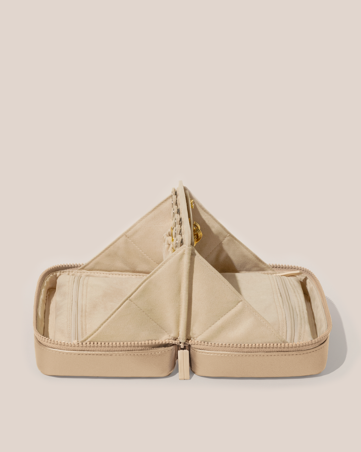 Open Afform Bisque (white) Vault, shown open and from the side, with one side for rings and earrings and the other for necklaces. Both sides have a zipper pocket for watches and bracelets.