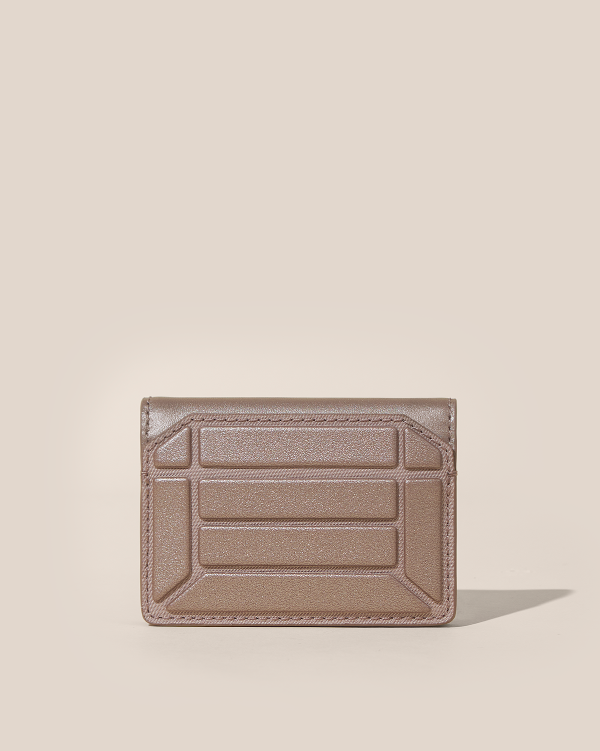 Closed Afform Bronze Card Case with structured geometric bar design on the front