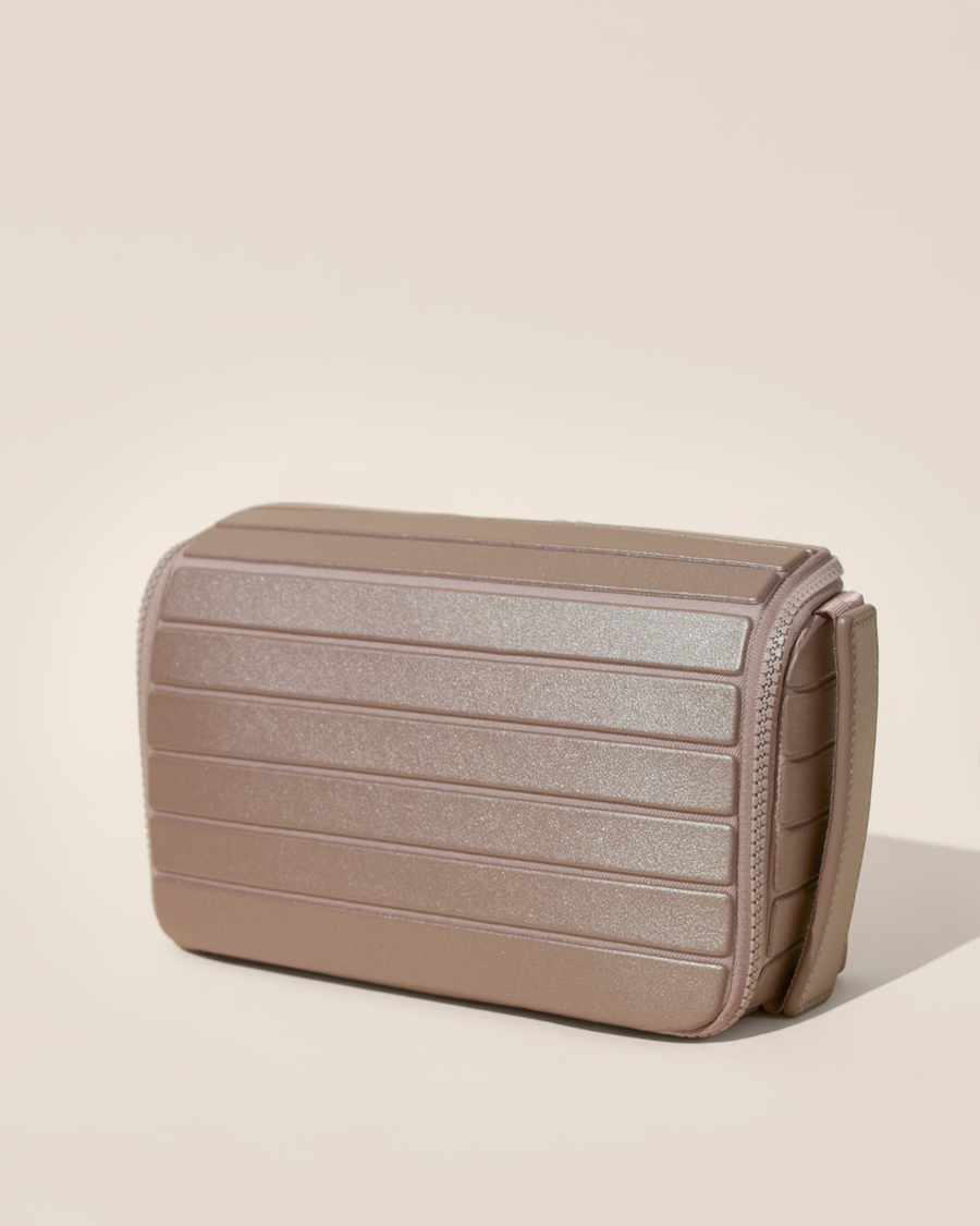 Closed Afform bronze Tech Kit electronics organizer, exterior view showing structured silhouette and carry handle