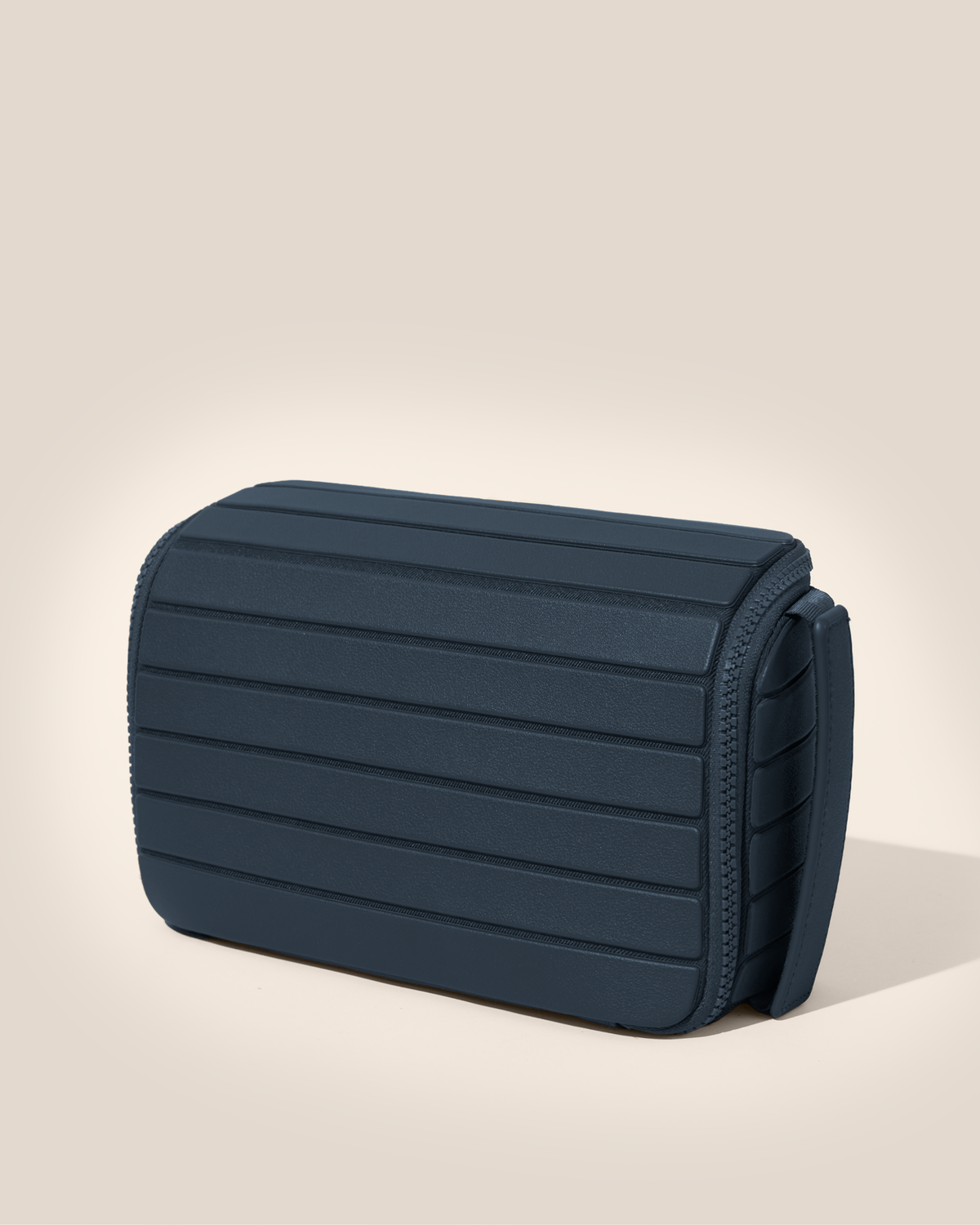 Closed Afform Indigo (navy) Tech Kit electronics organizer, exterior view showing structured silhouette and carry handle