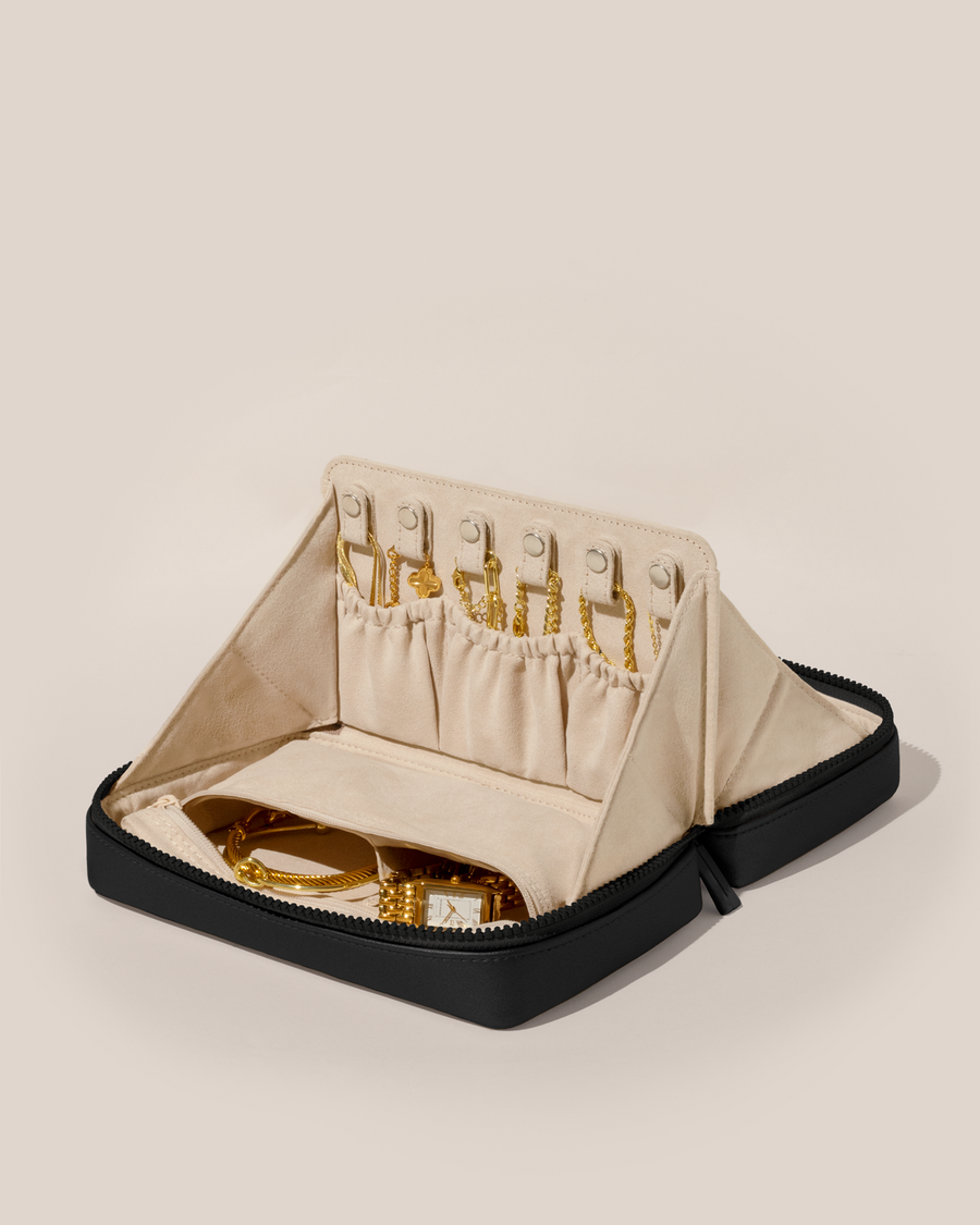 Open Afform Large Onyx (black) Vault, shown open and packed with necklaces in dedicated necklace pouches with snaps to keep them in place. Watches and bracelets are packed in a zipper pocket.