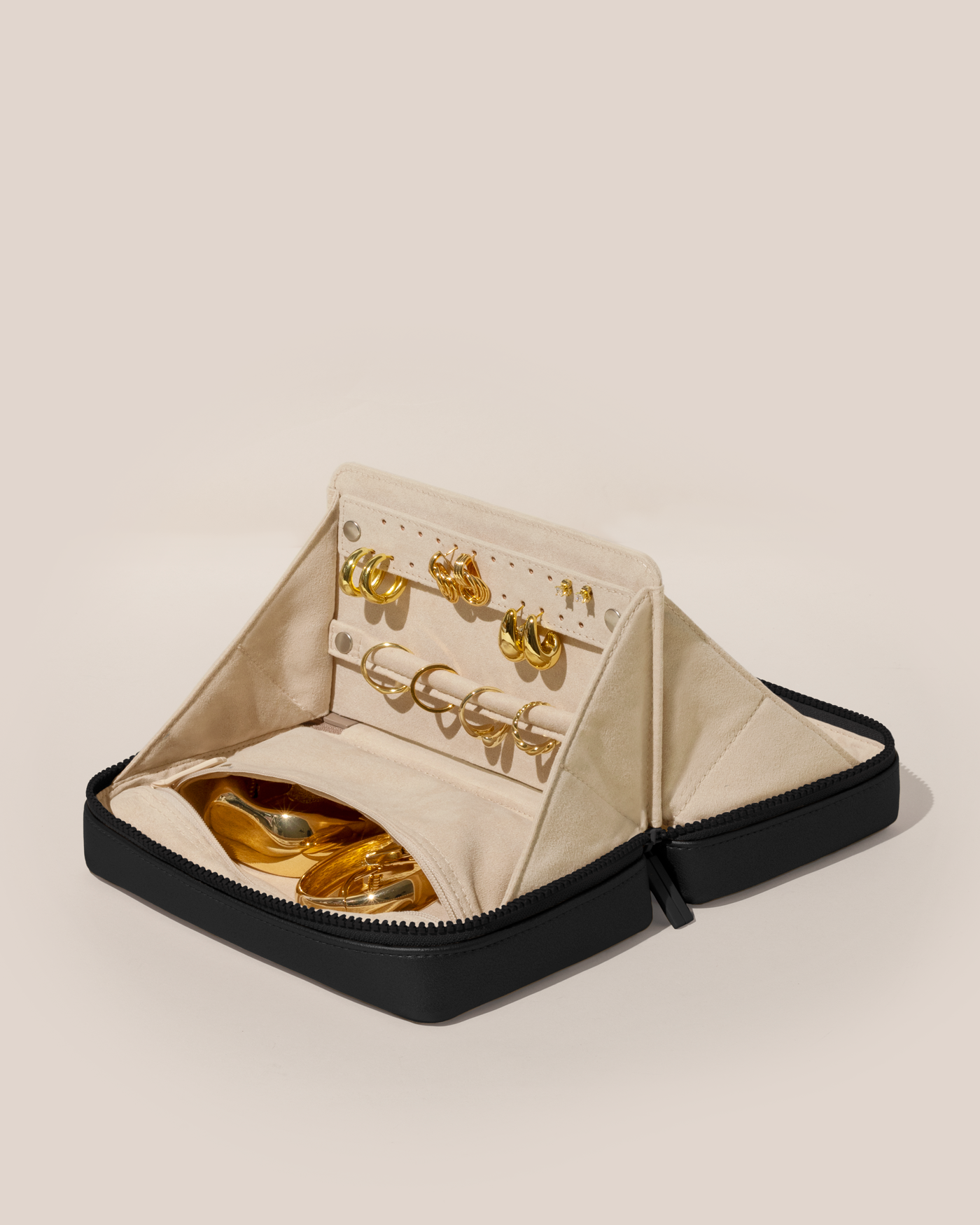 Open Afform Onyx (black) Vault, shown open and packed with rings and earrings on respective removable ring and earring bars. Watches and bracelets are packed in a zipper pocket.