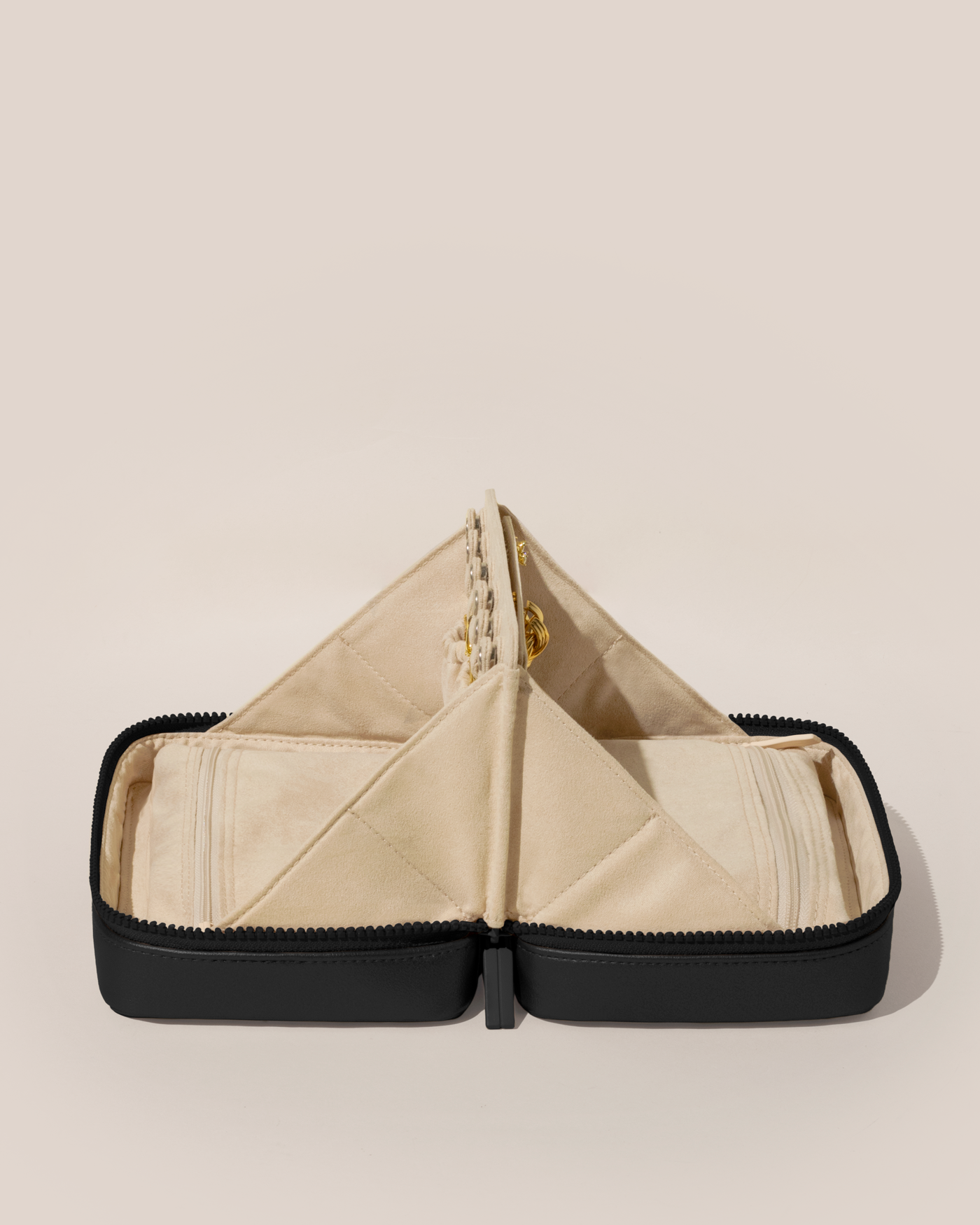 Open Afform Large Onyx (black) Vault, shown open and from the side, with one side for rings and earrings and the other for necklaces. Both sides have a zipper pocket for watches and bracelets.