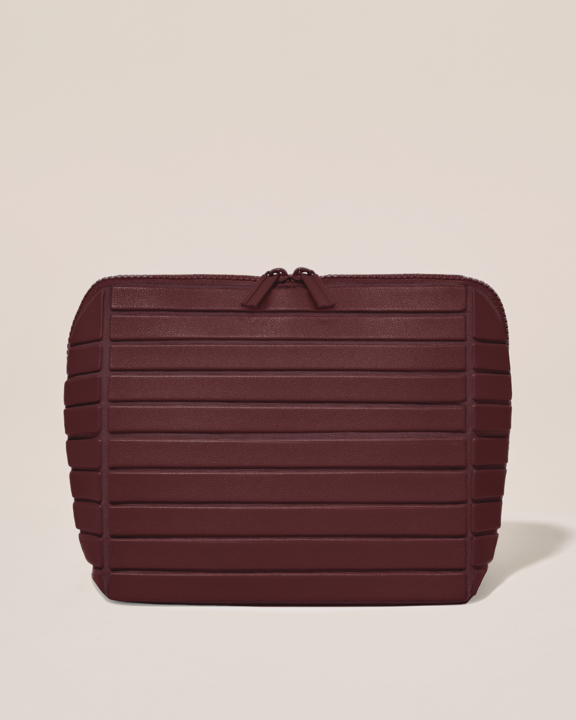 Closed Afform Medium Cassis (maroon) Traveller makeup bag with structured horizontal bar design