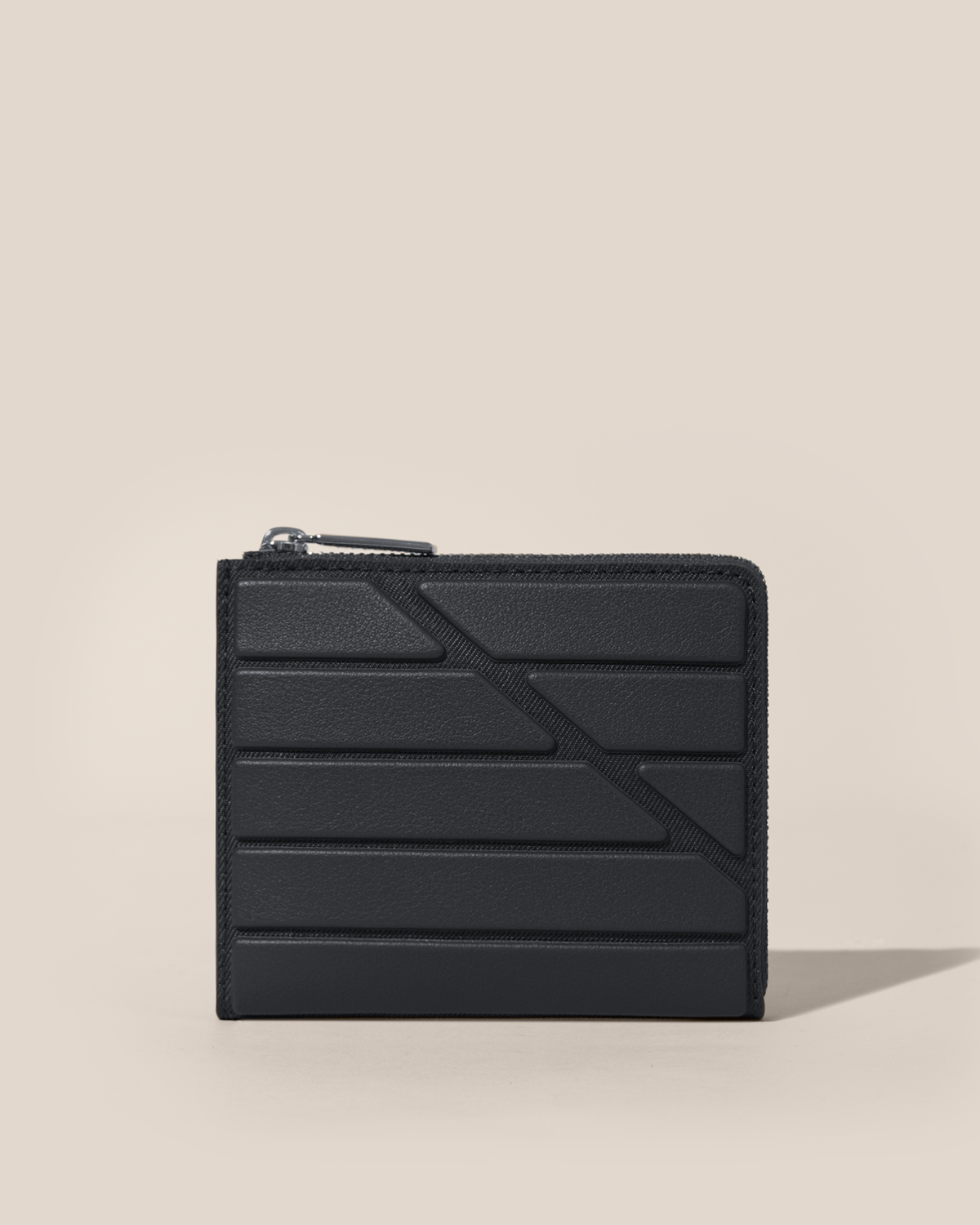 Closed Afform Onyx Zip Wallet with structured horizontal bar design on the front