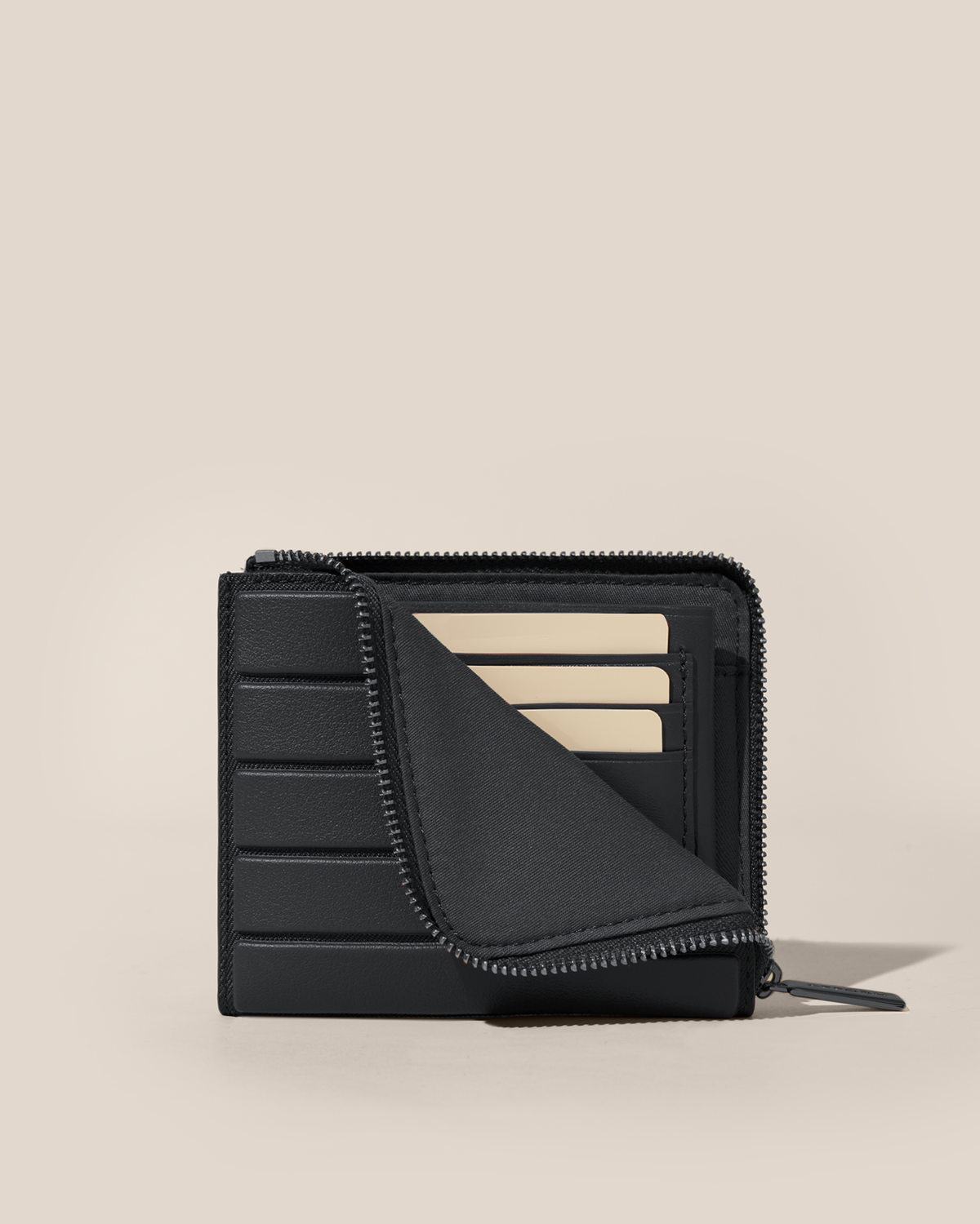 Partially unzipped Afform Onyx Zip Wallet revealing interior card slots holding cards