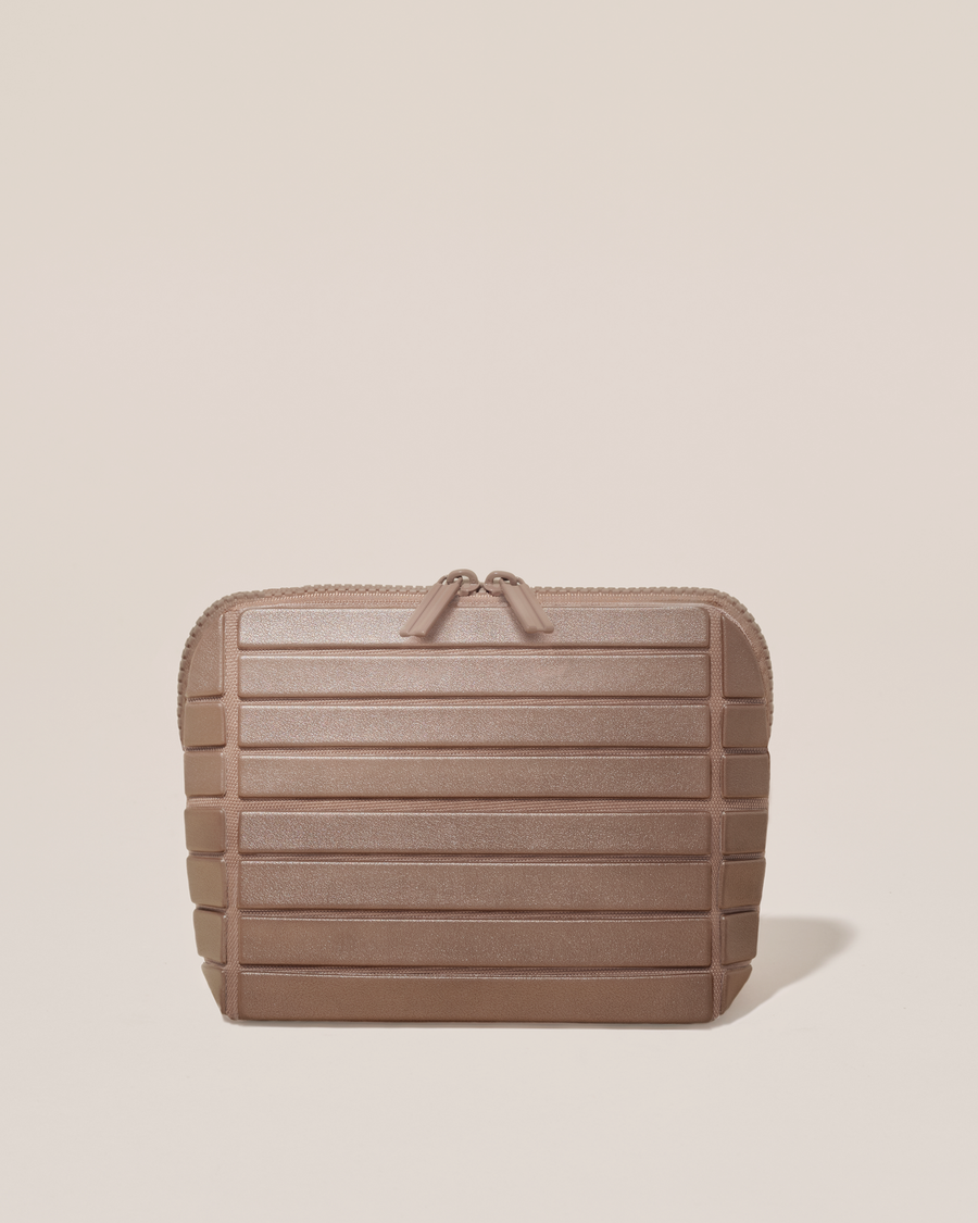 Closed Afform Small Bronze Traveller makeup bag with structured horizontal bar design