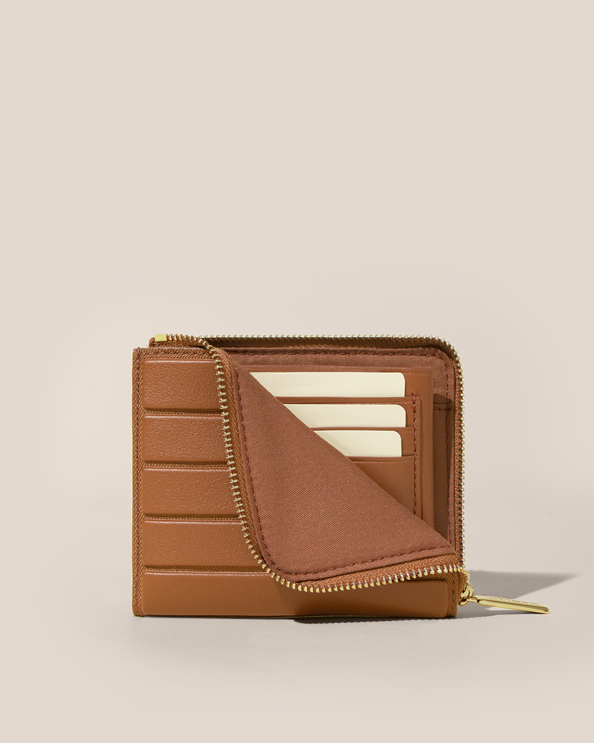 Partially unzipped Afform Vicuna Zip Wallet revealing interior card slots holding cards