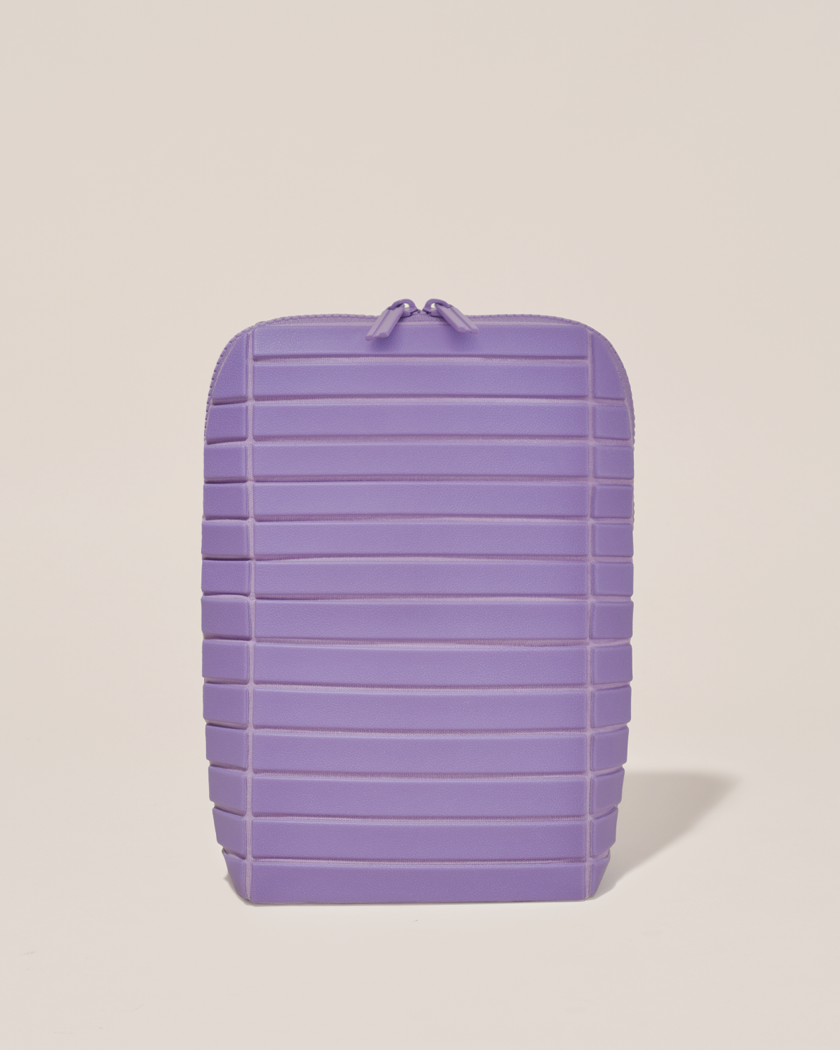 Closed Parallelle Lilac (purple) Brush Traveller makeup bag with structured horizontal bar design