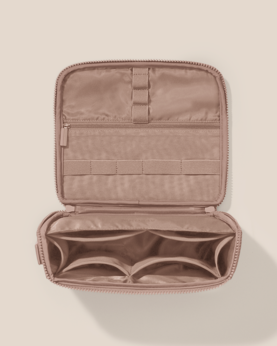 Overhead view of the Afform bronze Tech Kit electronics organizer, showcasing its 8 elastic loops, 6 mesh pockets, and 1 zipper pocket on the upper panel and a structured lower compartment with dividers