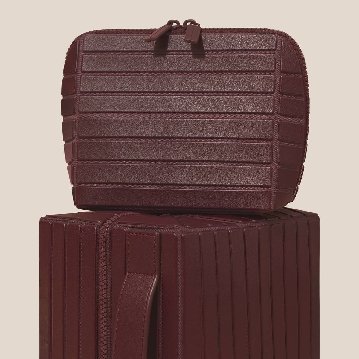 The medium traveller and large kit in Cassis (maroon)