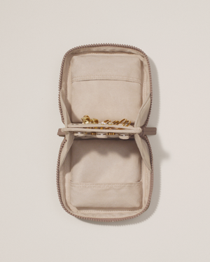 Top down image of the small vault showing it holds a few pieces of jewelry.