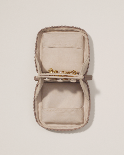 Top down image of the small vault showing it holds a few pieces of jewelry.