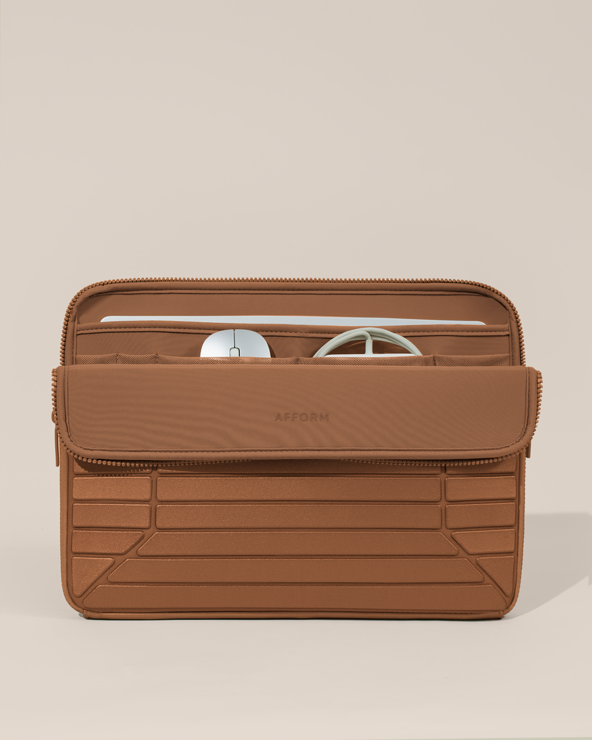 Afform 15" vicuna (brown) Laptop Case partially open, fold-down front panel revealing a laptop in the neoprene sleeve and mesh pockets with a mouse and charger, structured horizontal bar detail on exterior
