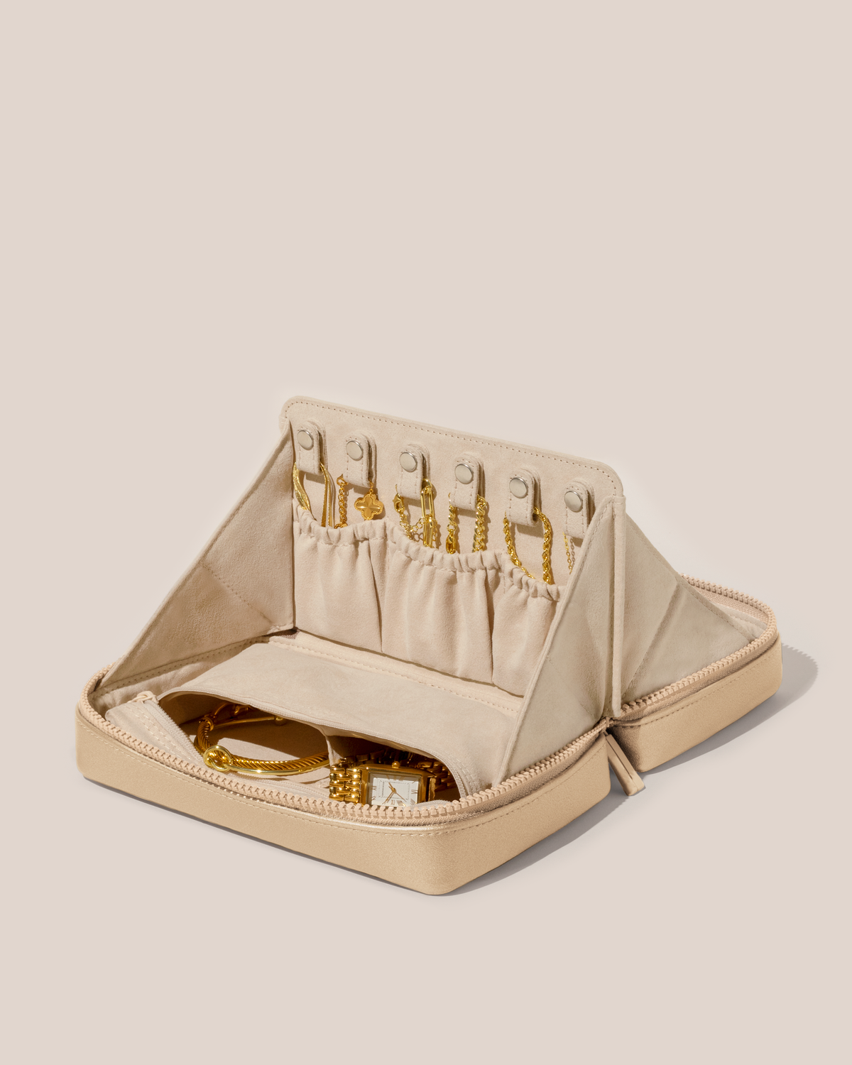 Open Afform Bisque (White) Vault, shown open and packed with necklaces in dedicated necklace pouches with snaps to keep them in place. Watches and bracelets are packed in a zipper pocket.