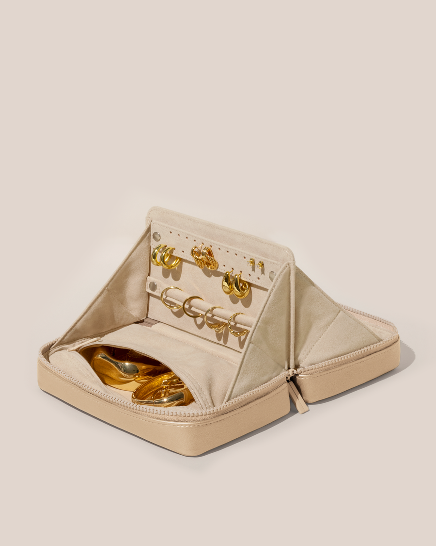 Open Afform Bisque (white) Vault, shown open and packed with rings and earrings on respective removable ring and earring bars. Watches and bracelets are packed in a zipper pocket.