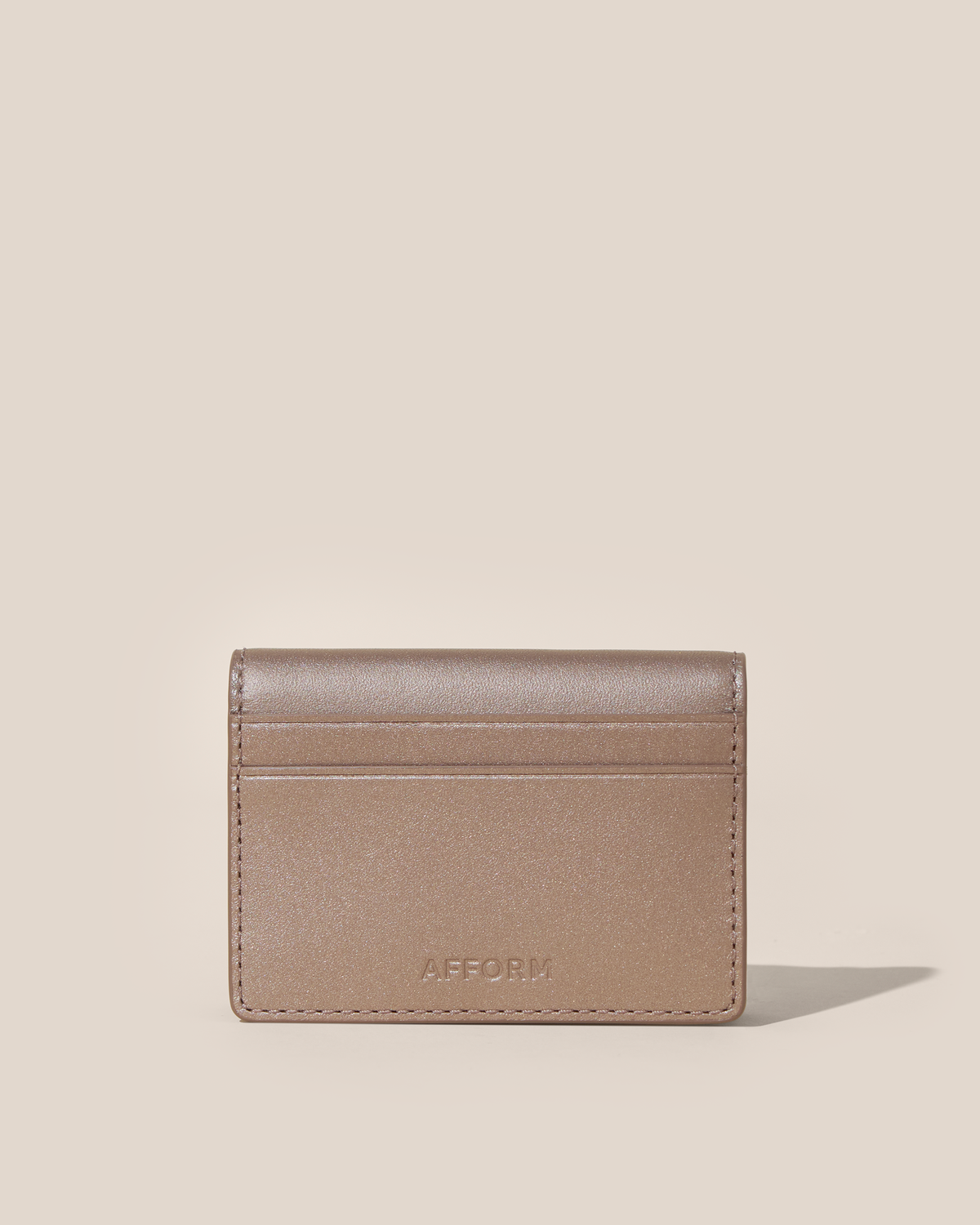 Back of the Afform Bronze Card Case showing an exterior slip pocket and embossed Afform logo
