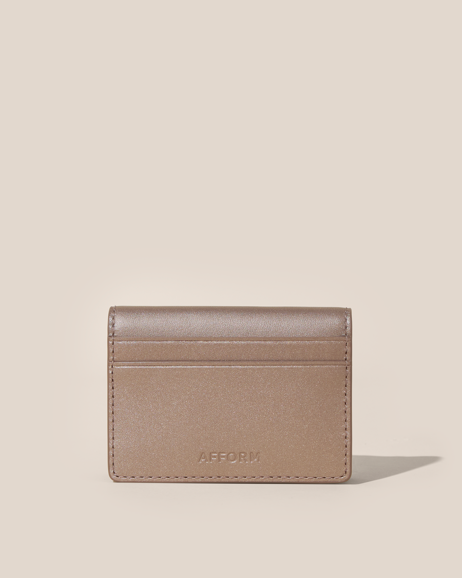 Back of the Afform Bronze Card Case showing an exterior slip pocket and embossed Afform logo