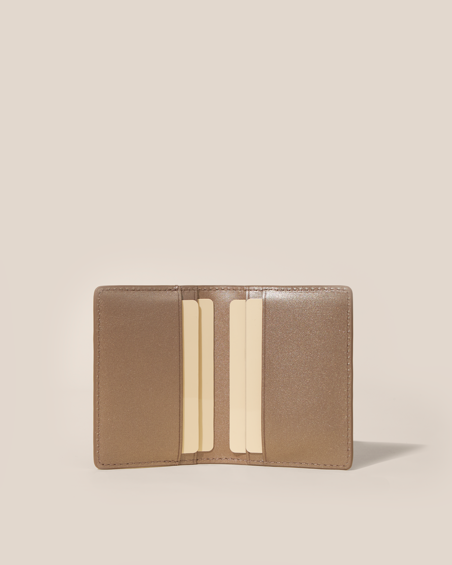Open Afform Bronze Card Case showing four interior card slots holding cards