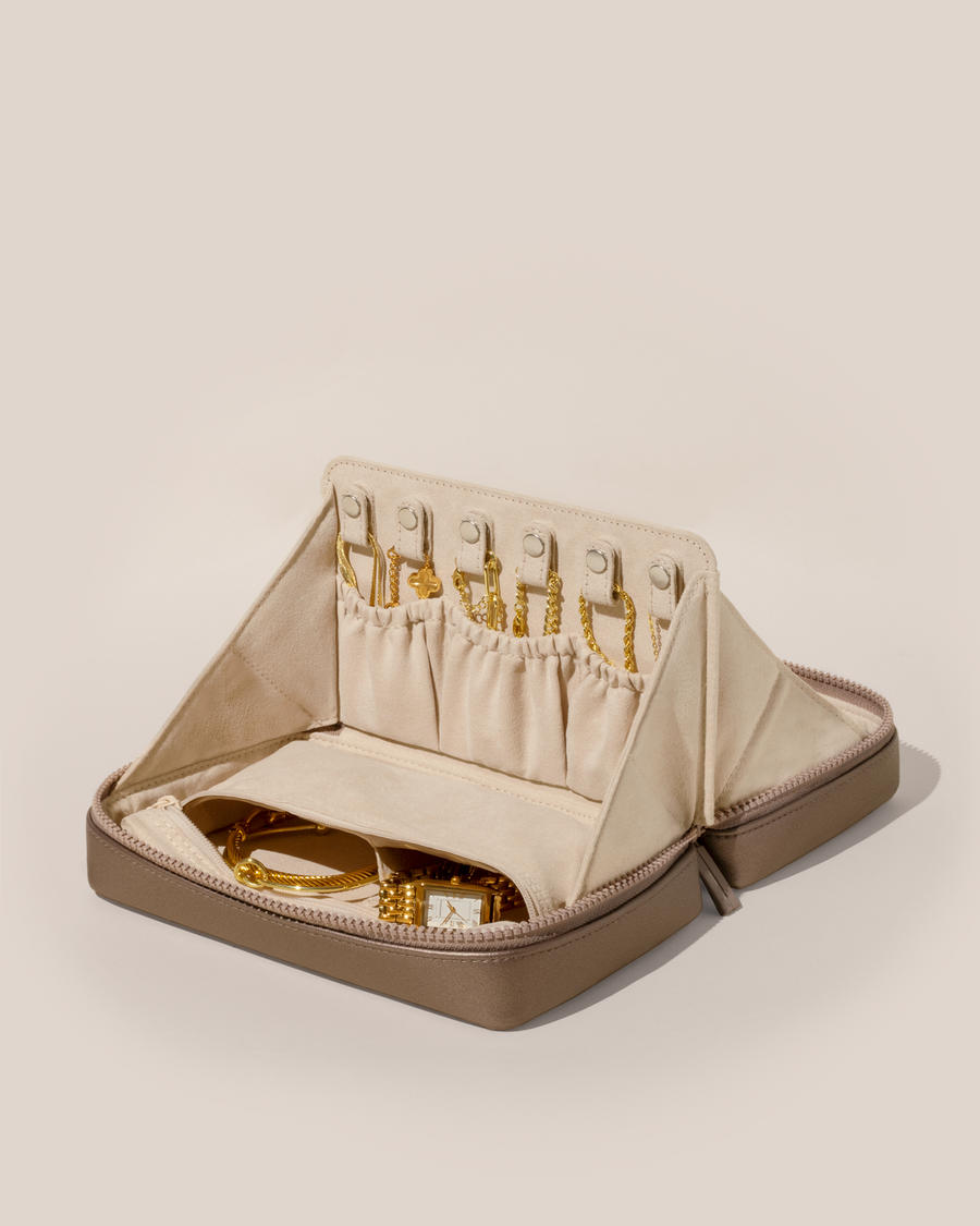 Open Afform Large Bronze Vault, shown open and packed with necklaces in dedicated necklace pouches with snaps to keep them in place. Watches and bracelets are packed in a zipper pocket.