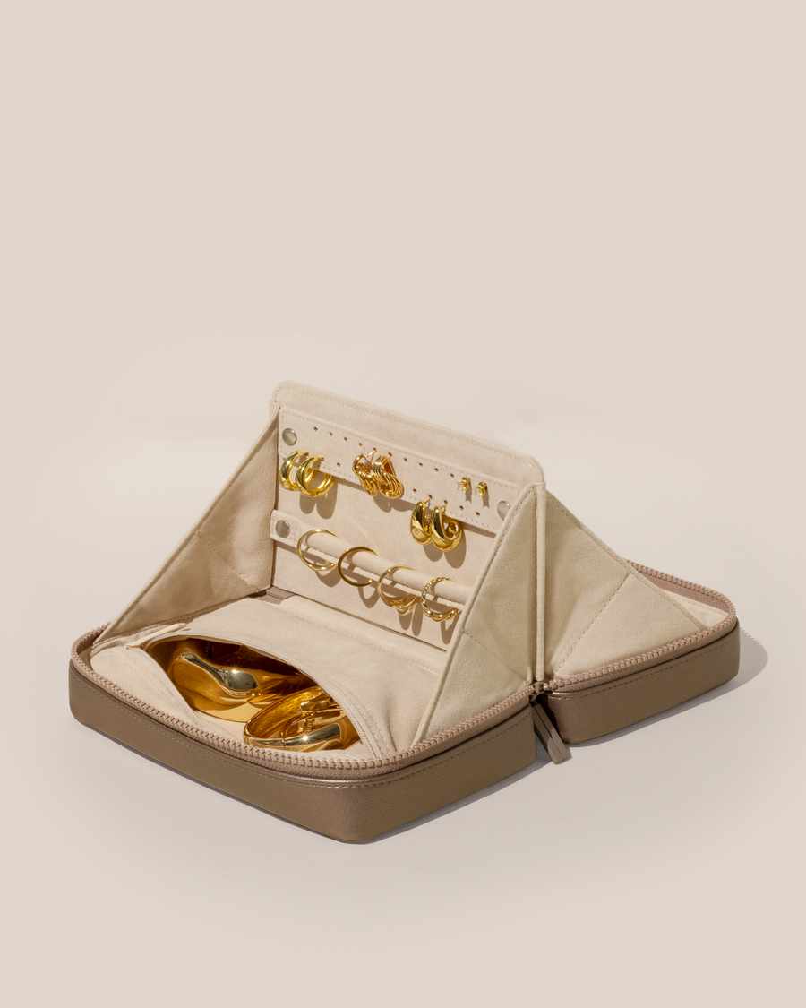 Open Afform Large Bronze Vault, shown open and packed with rings and earrings on respective removable ring and earring bars. Watches and bracelets are packed in a zipper pocket.