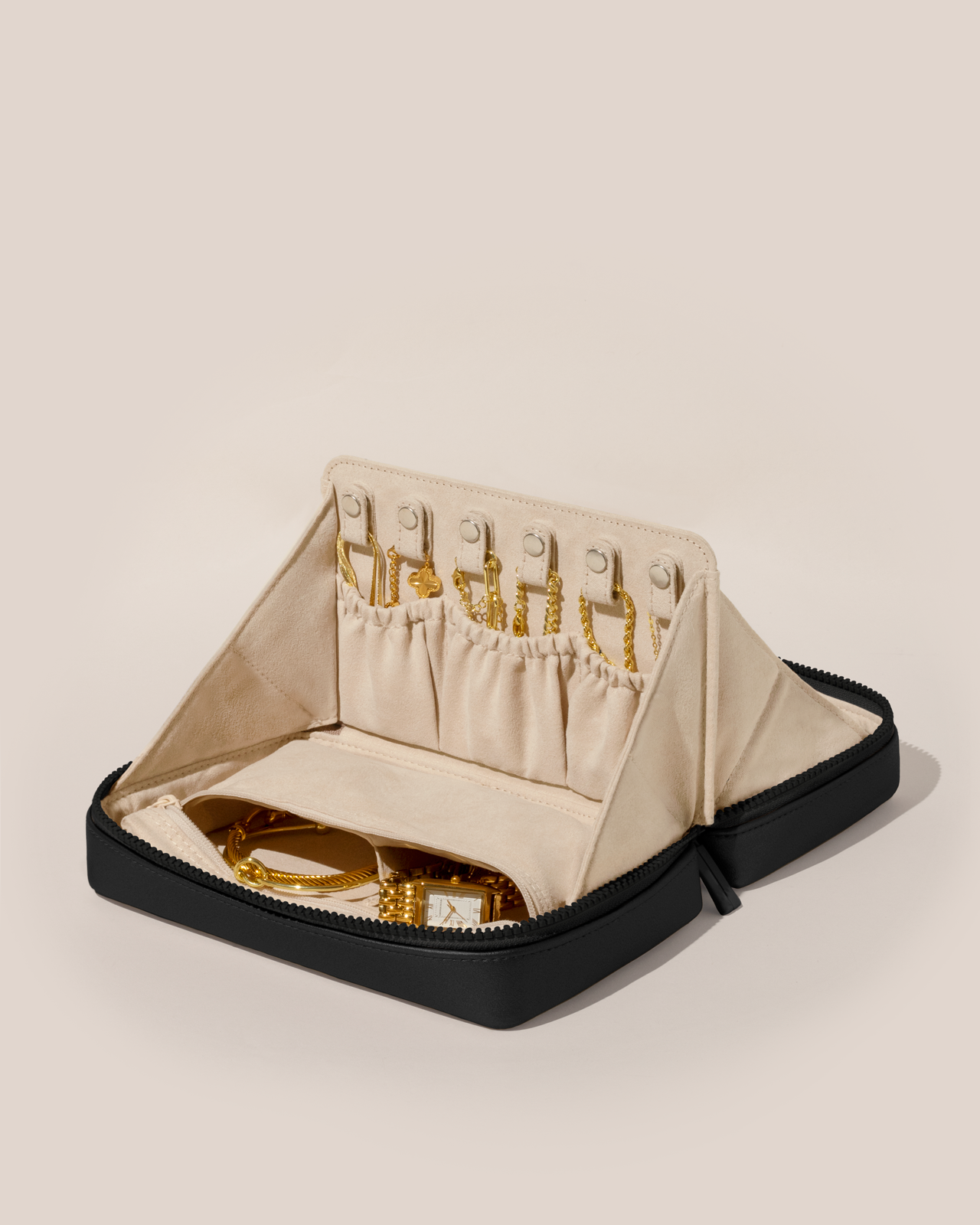 Open Afform Large Onyx (black) Vault, shown open and packed with necklaces in dedicated necklace pouches with snaps to keep them in place. Watches and bracelets are packed in a zipper pocket.