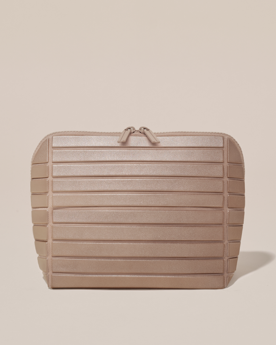 Closed Afform Medium Bronze Traveller makeup bag with structured horizontal bar design