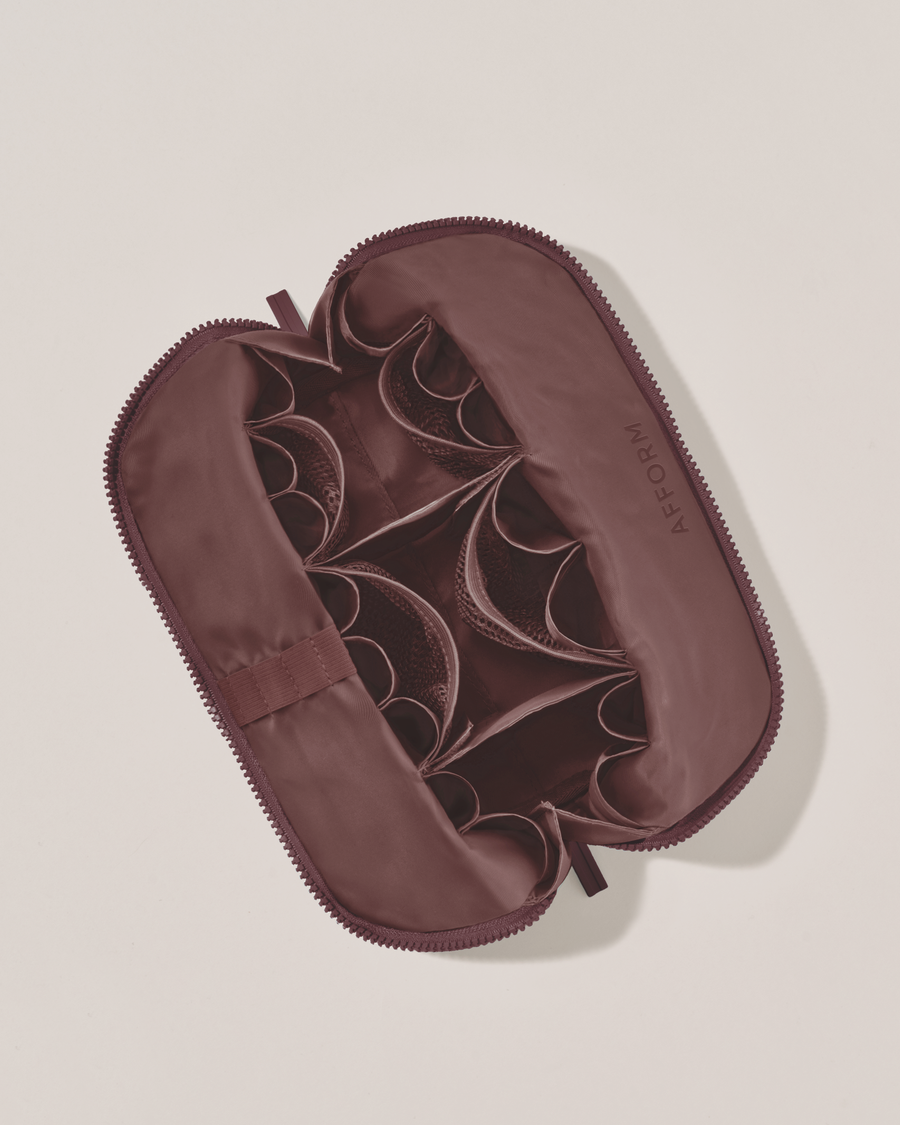 Interior view of Afform Medium Cassis (maroon) Traveller makeup bag showing empty pockets, pouches, and elastic holders