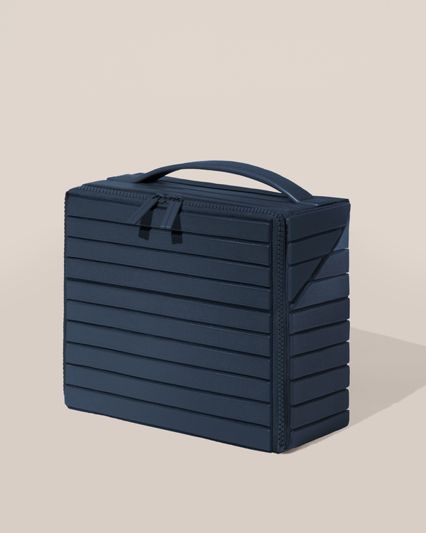 Closed Afform Medium Indigo (blue) Kit toiletry bag with a compact, zip-around design and top handle for elevated everyday or travel organization