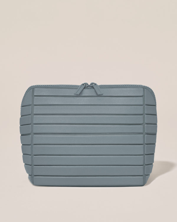 Closed Afform Medium Slate (blue) Traveller makeup bag with structured horizontal bar design