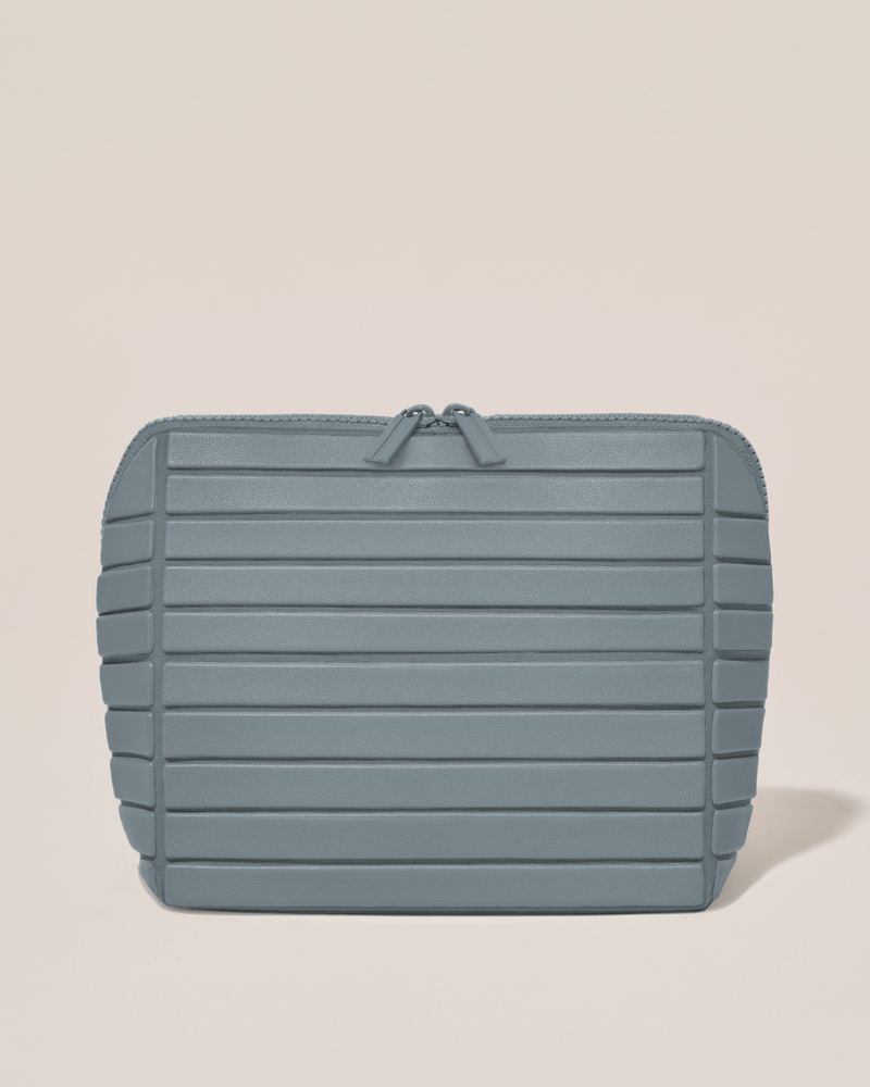 Closed Afform Medium Slate (blue) Traveller makeup bag with structured horizontal bar design
