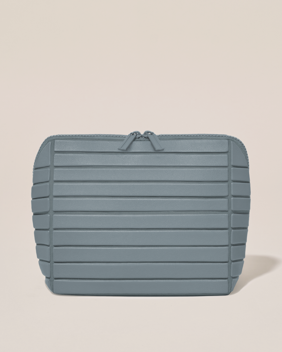 Closed Afform Medium Slate (blue) Traveller makeup bag with structured horizontal bar design