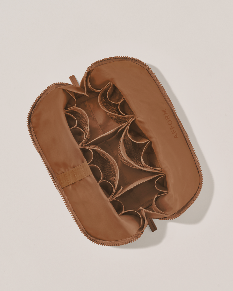 Interior view of Afform Medium Vicuna (brown) Traveller makeup bag showing empty pockets, pouches, and elastic holders