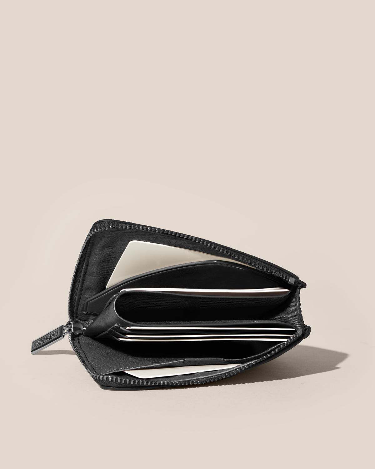 Fully open Afform Onyx Zip Wallet showing multiple card slots and a full-length bill compartment