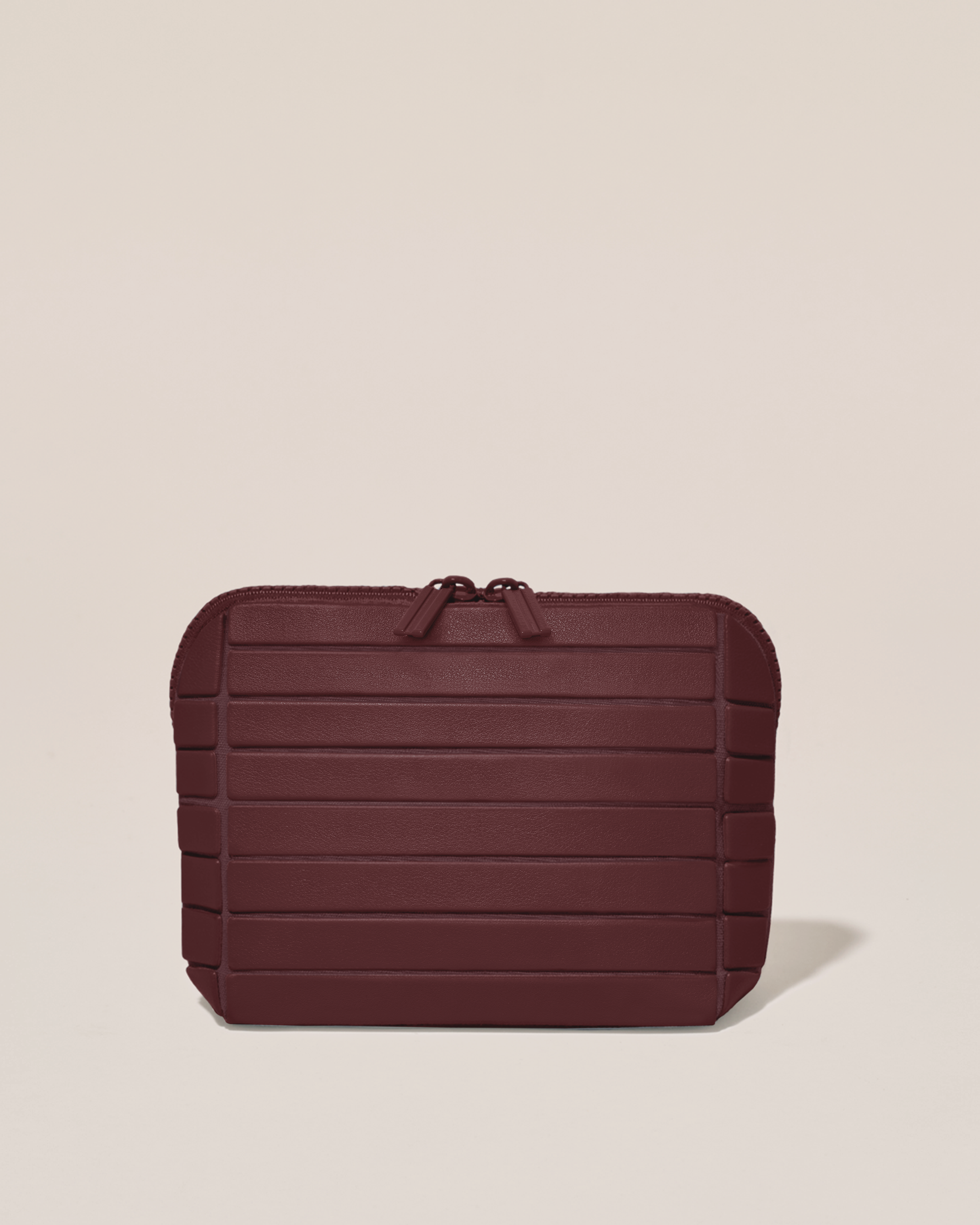 Closed Afform Small Cassis (maroon) Traveller makeup bag with structured horizontal bar design