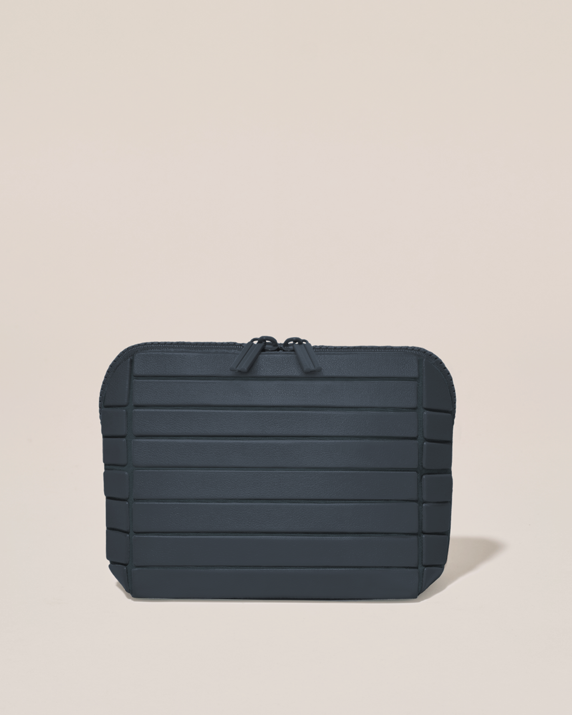 Closed Afform Small Indigo (navy) Traveller makeup bag with structured horizontal bar design