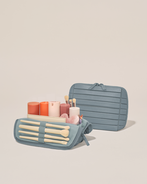 Image of the small traveller open with a small amount of products.