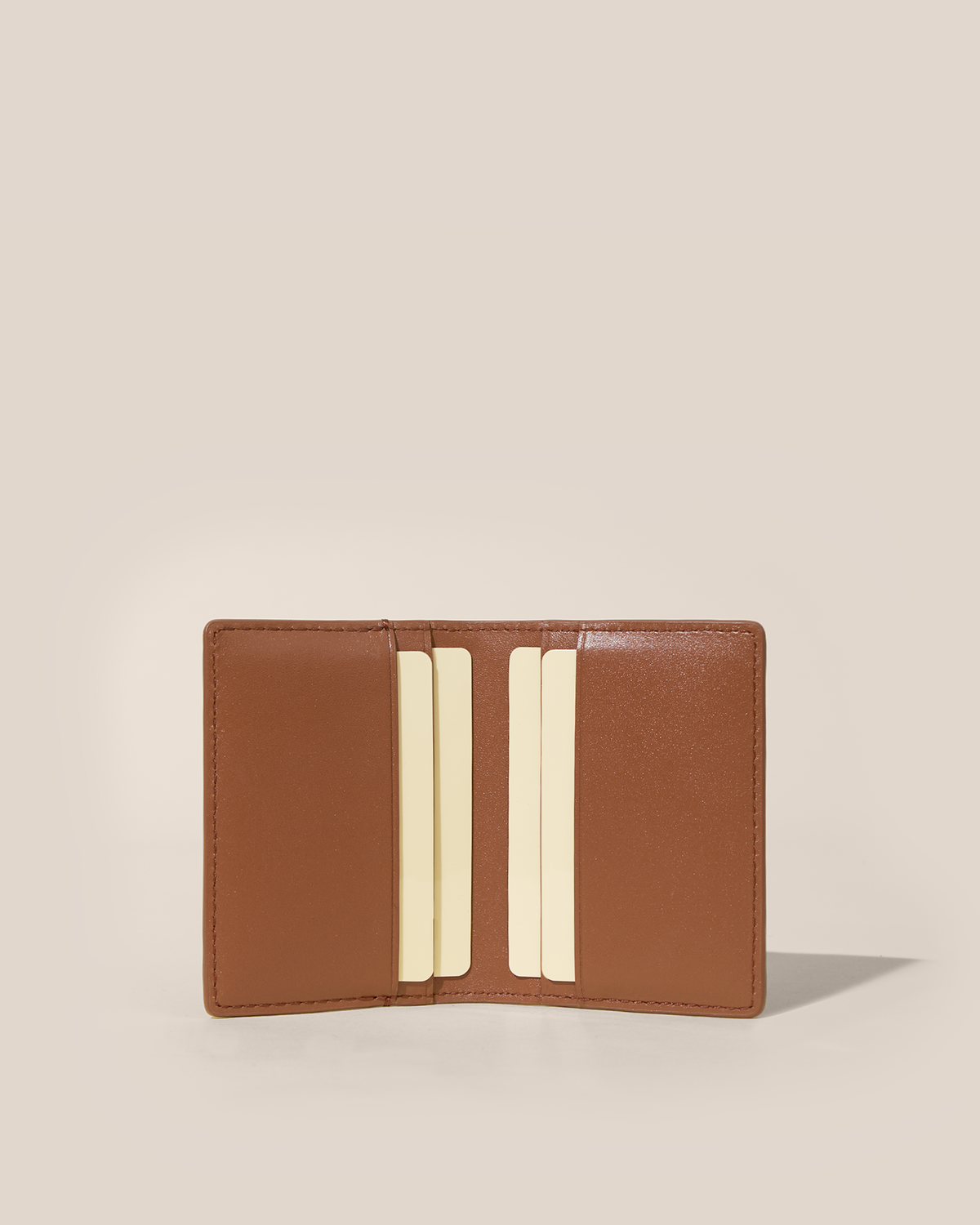 Open Afform Vicuna Card Case showing four interior card slots holding cards