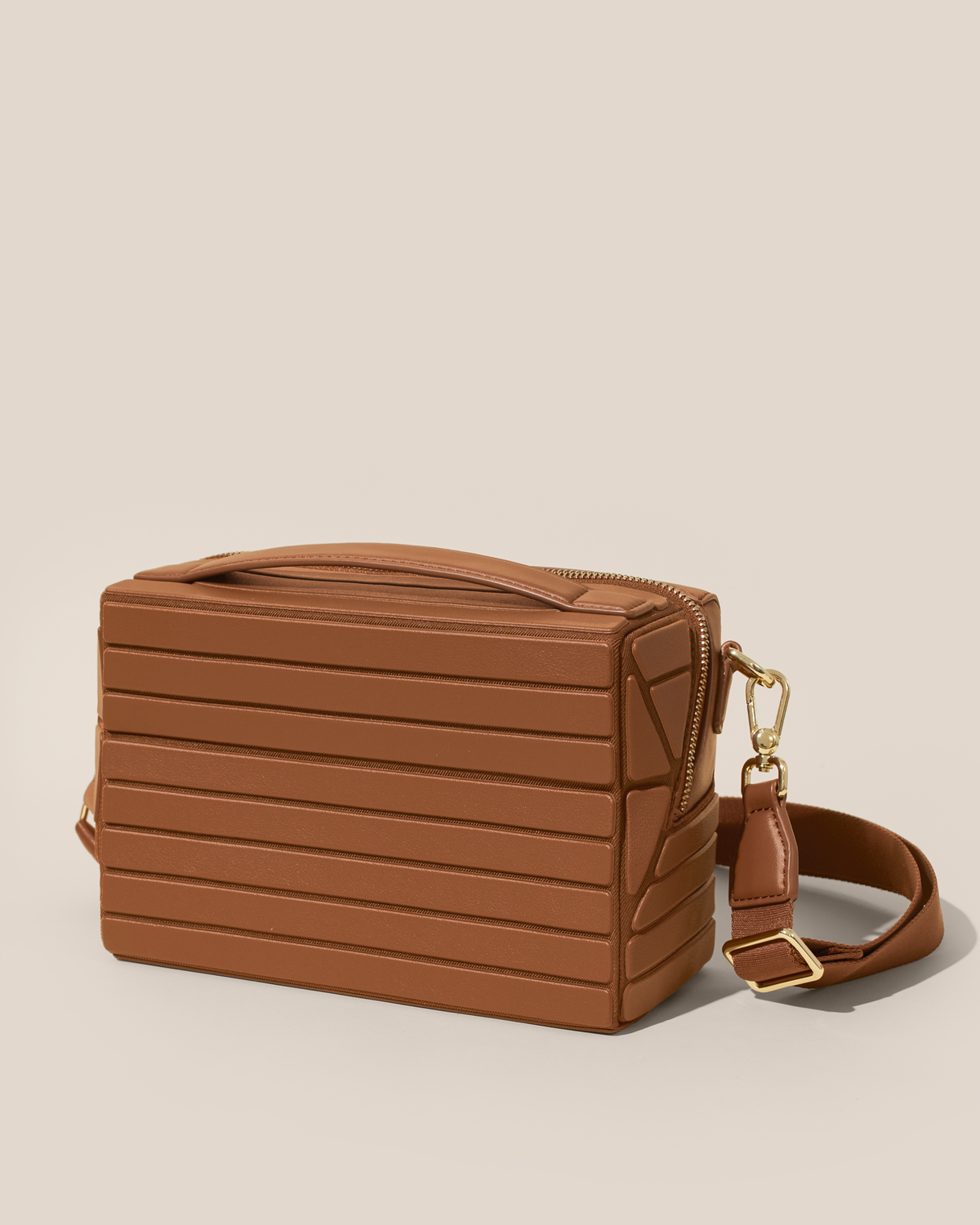 Closed Afform Vicuna Crossbody bag with structured horizontal bar design and gold hardware