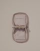 Video of the Small Vault showing its snaps being used to fasten and unfasten a necklace and a bracelet being removed from one of the extra compartment pouches